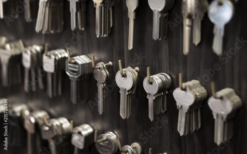 Several Keys type such as household and car key use for copying or duplicating hang on the wall in the locksmith workshop photo