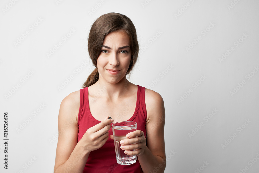 woman drinking water pills woman drinking water pills
