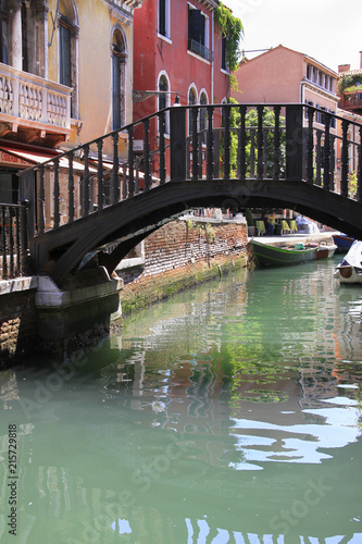 Venice - narrow canal and bridge - famous place, Veneto, Italy.
