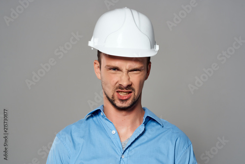 architect in helmet construction blueprints