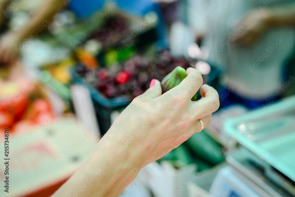Adult person buying, selecting choosing fresh food abstract background, light day shop market. green commodity groceries consumption life checkout. Adult person buying, selecting choosing fresh food abstract background, light day shop market. green commodity groceries consumption life checkout.