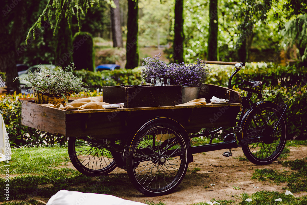 Old wooden cart to transport goods used for decoration at a wedding.