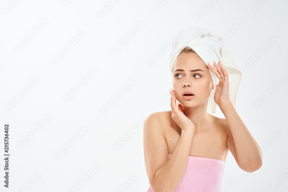 woman in a towel on her head on an isolated background woman in a towel on her head on an isolated background
