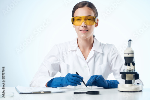scientist in laboratory with test tubes © SHOTPRIME STUDIO