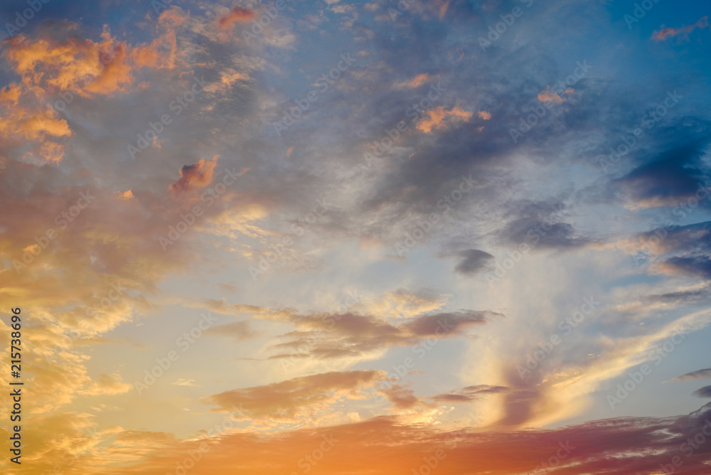 Beautiful sunset with the sun of orange tones behind the mountains and deep blue sky Beautiful sunset with the sun of orange tones behind the mountains and deep blue sky