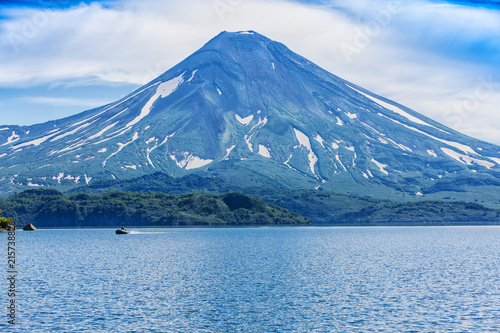 Picturesque summer volcanic landscape of Kamchatka Peninsula: view of active Ilyinsky Volcano (Ilyinskaya Sopka). Eurasia, Russia, Far East, Kurile lake, South Kamchatka Sanctuary