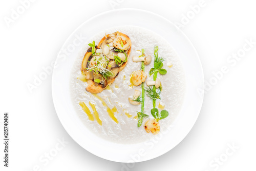 Cream mushroom soup with scallops, herbs and toast bread.