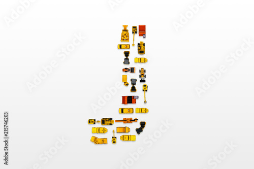 English letters formed by arrangement of Car toy diecast on the white background   Top view