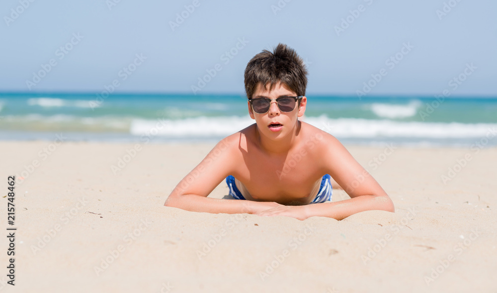 Young child on holidays at the beach scared in shock with a surprise face, afraid and excited with fear expression Young child on holidays at the beach scared in shock with a surprise face, afraid and excited with fear expression