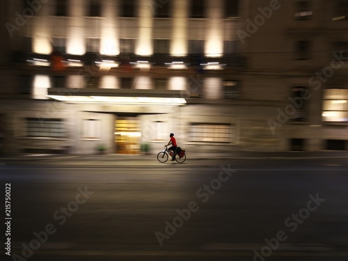 Rome,Italy-July 28, 2018: A man on a bike goes down Cavour street in the night © Khun Ta