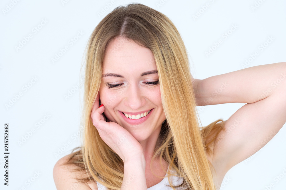 emotion face. happy smiling calm content woman young beautiful blond girl portrait on white background.