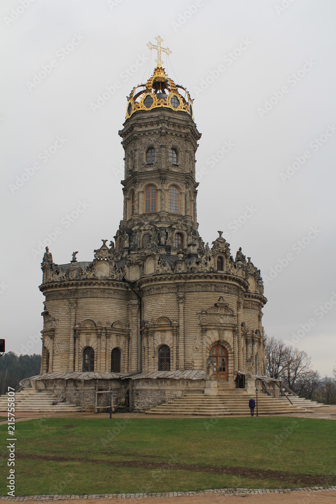Ancient stone single-domed church with an openwork dome and stone carvings