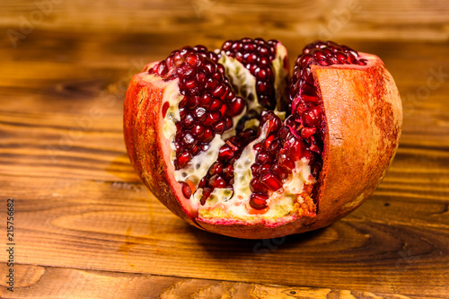 Fresh ripe garnet fruit on wooden table