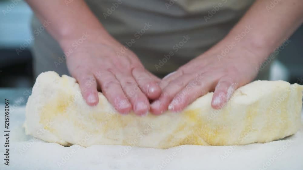 Making cookies, dough close-up of women's hands in the confectionery kitchen. Making cookies, dough close-up of women's hands in the confectionery kitchen.