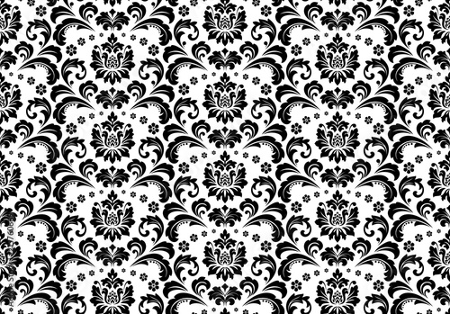 Wallpaper in the style of Baroque. Seamless vector background. White and black floral ornament. Graphic pattern for fabric, wallpaper, packaging. Ornate Damask flower ornament