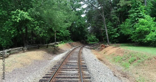 Trees damaged near railroad tracks.