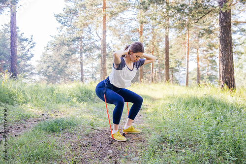 woman doing exercises in a park