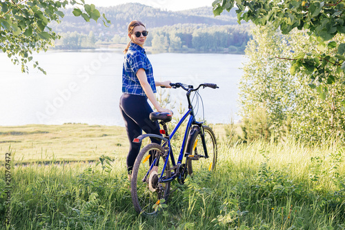 Young woman riding a bike