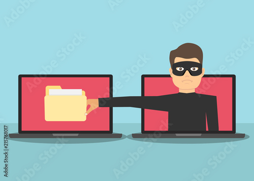 Scam. The Internet scammer wants to steal personal data. A man with a hand wants to steal information from a laptop.