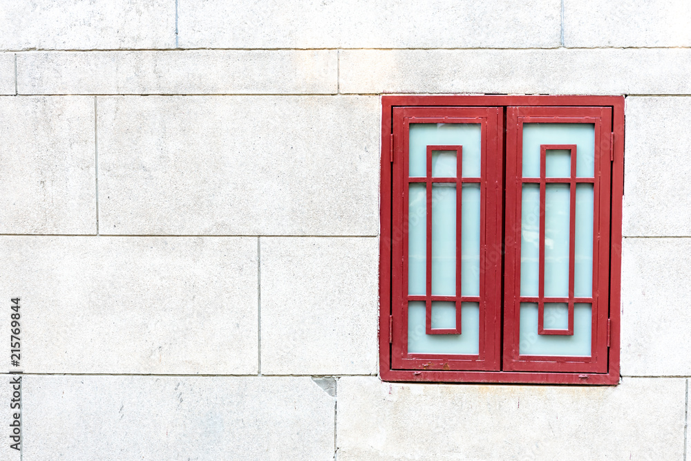 Obraz premium red Chinese window on the brick wall