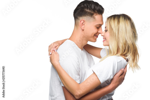 affectionate couple hugging and going to kiss isolated on white