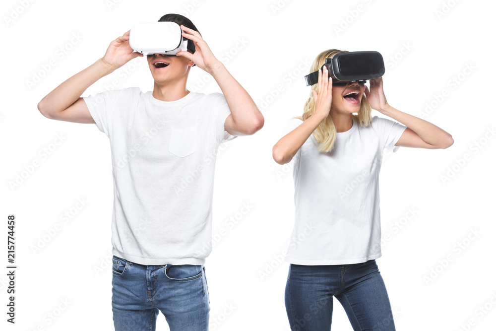 excited couple using virtual reality headsets isolated on white excited couple using virtual reality headsets isolated on white