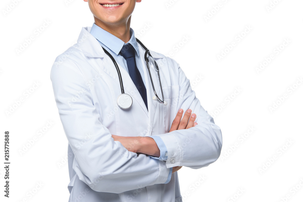 cropped shot of smiling young doctor with crossed arms isolated on white cropped shot of smiling young doctor with crossed arms isolated on white
