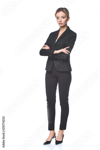 attractive young businesswoman looking at camera isolated on white
