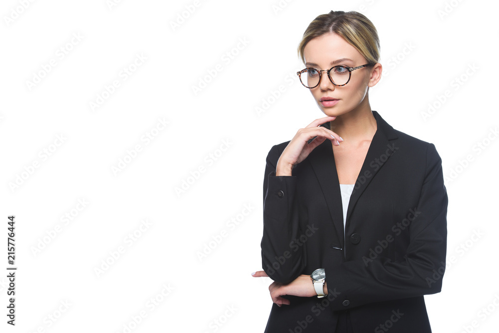 thoughtful young businesswoman in stylish suit looking away isolated on white