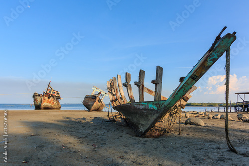 Broken and old fishing boat , Three Ship Wreck in Kuala Penyu, Sabah, Malaysia , Abandoned Ship at sabah borneo malaysia Image has grain or blurry or noise and soft focus when view at full resolution. © alenthien