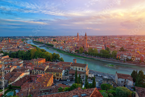Panoramic aerial view of Verona, Italy at summer sunset, sun lens flare