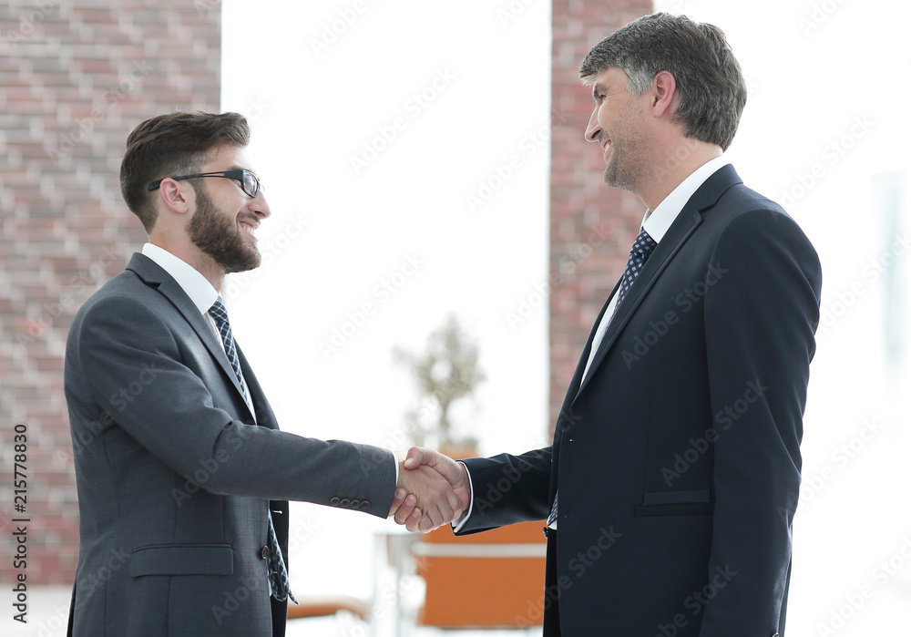 businessmen shaking hands on business meeting in office businessmen shaking hands on business meeting in office