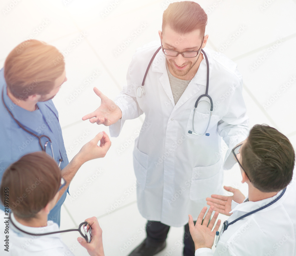 view from the top.a group of doctors discussing ideas view from the top.a group of doctors discussing ideas