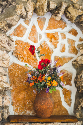 Fototapeta Naklejka Na Ścianę i Meble -  Сlay handmade vase with wildflowers