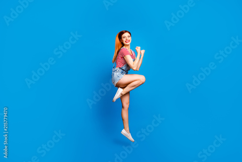 Youngster youth emotion expressing concept. Full length body size photo studio shoot of cool trendy lovely joyful cheerful glad satisfied lady jumping up isolated bright color vivid background