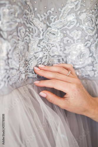 Details of a gray fashionable silk wedding dress embroidered with lace  beads and bugles