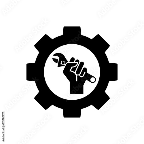 Icono plano engranaje y mano con llave inglesa en color negro