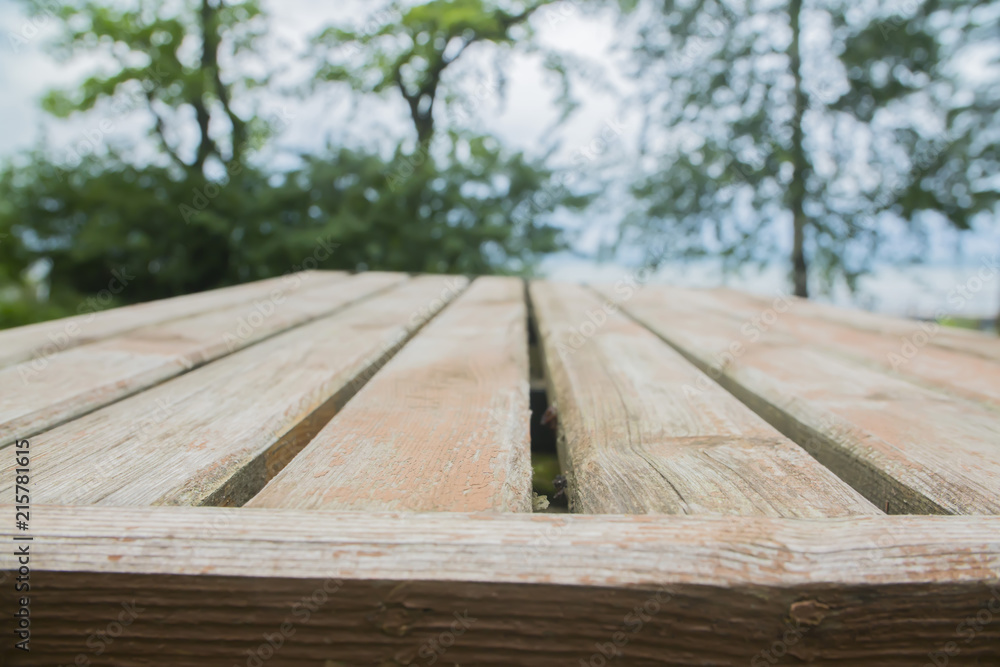 Fototapeta premium Empty wood table top on blur abstract background