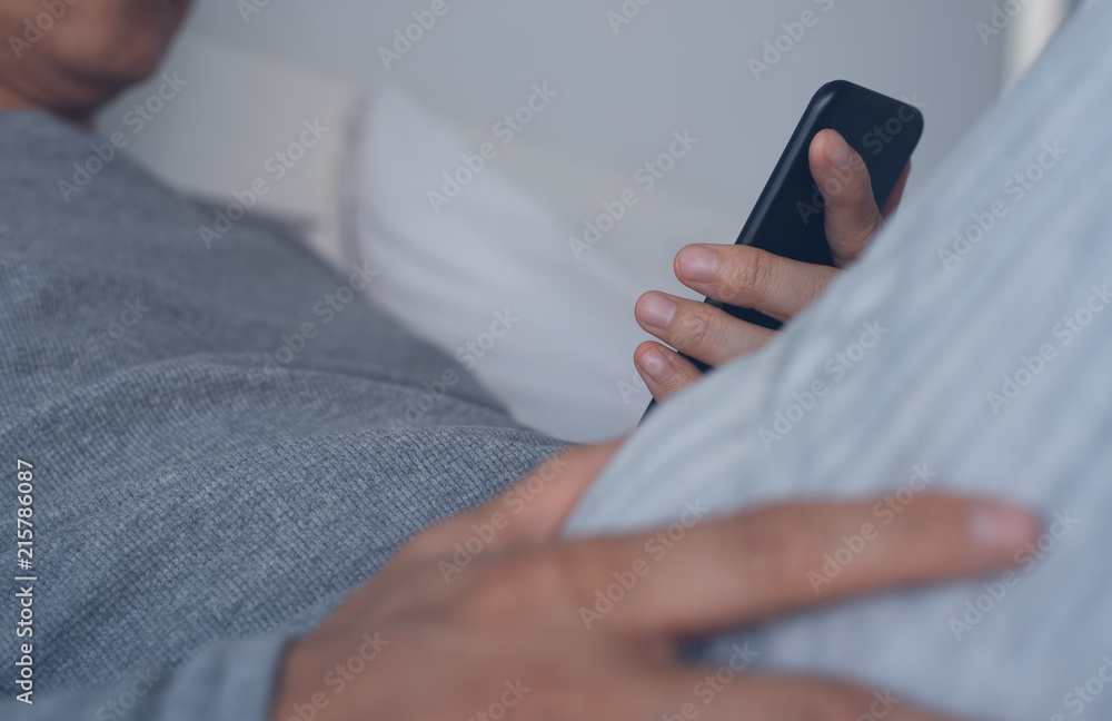 Fototapeta premium Man using smartphone