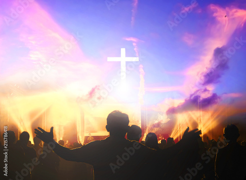 Church worship concept:Christians raising their hands in praise and worship at a night music concert photo