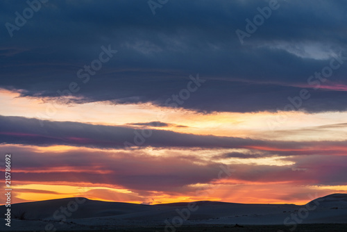 picturesque view of beautiful sunset sky over mountain silhouettes 