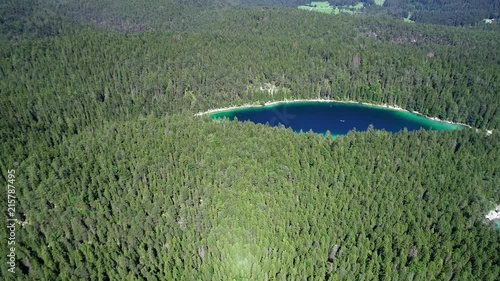 4K scenic flight of Eibsee in Bavaria on the bottom of Zugspitze the highest mountain in germany