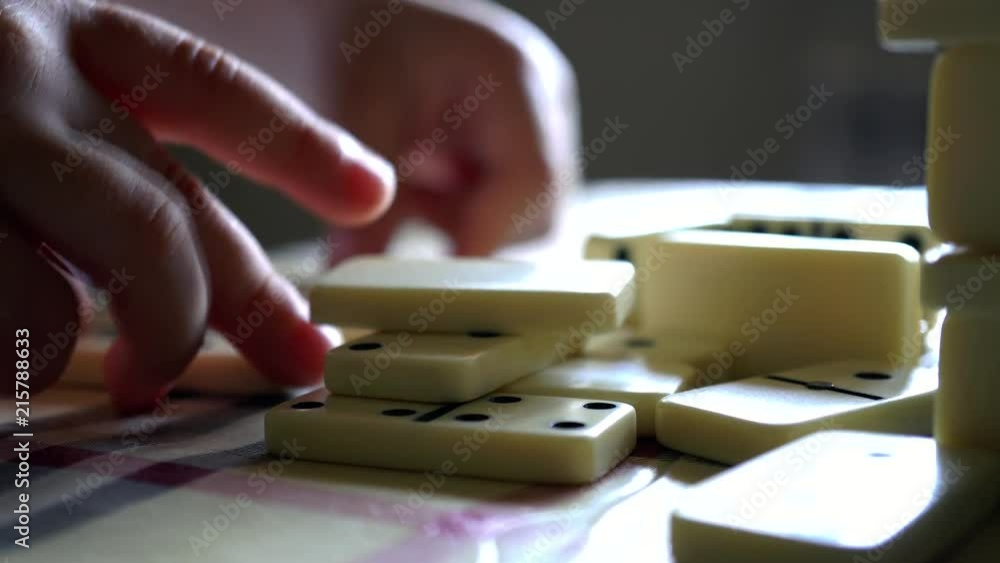 Little boy playing dominos and blocks. Close up. Macro. 4K Little boy playing dominos and blocks. Close up. Macro. 4K