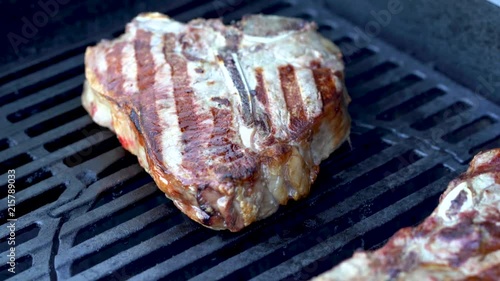 4K footage of ribeye steak grilling and slicing