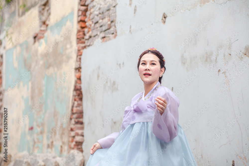 Woman wearing Hanbok, Korean traditional dress costume walk and travel in Seoul city, South Korea Woman wearing Hanbok, Korean traditional dress costume walk and travel in Seoul city, South Korea