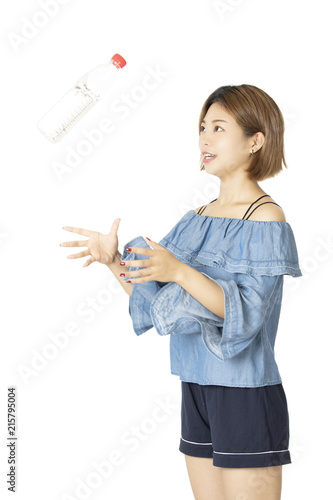 Beautiful Chinese woman holding water bottle isolated on white background