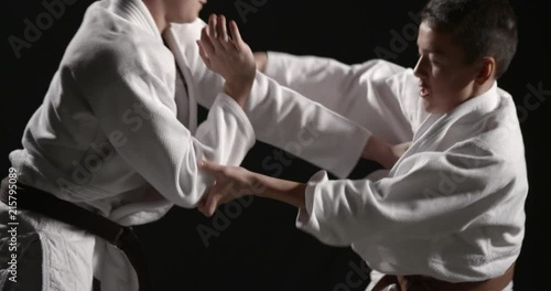 Judo struggle between two young athletes
