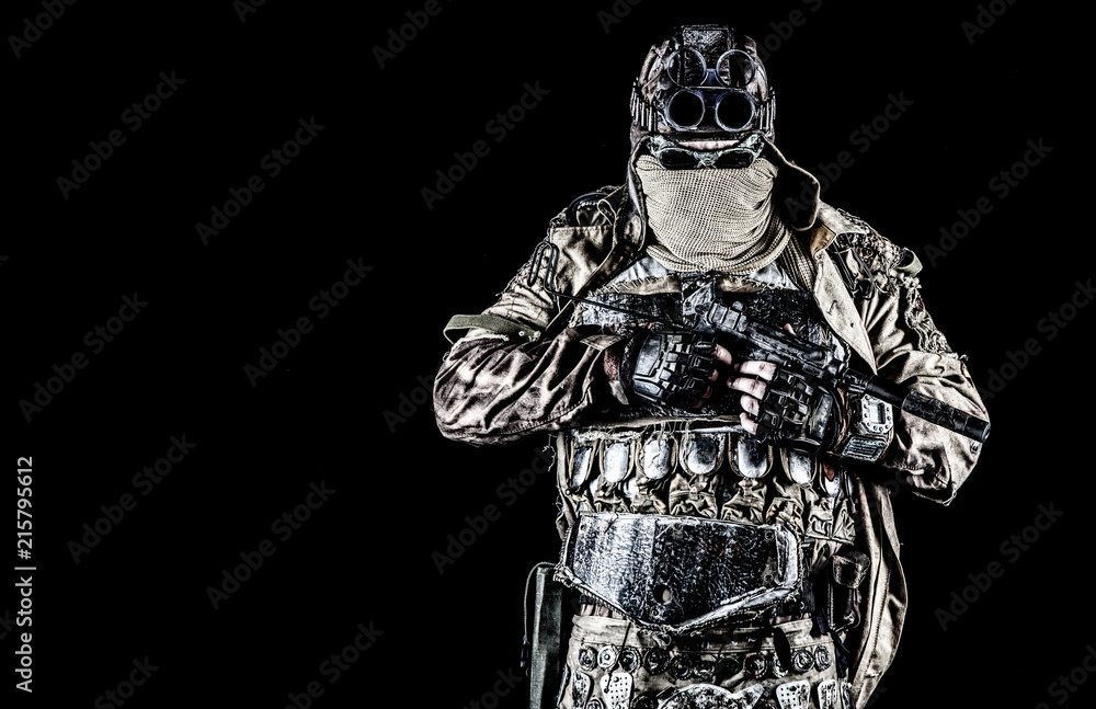 Post apocalyptic world bandit or marauder, nuclear disaster survivor, veteran stalker in face mask and sunglasses, handicraft lamellar armor, armed with handmade pistol, isolated on black studio shoot Post apocalyptic world bandit or marauder, nuclear disaster survivor, veteran stalker in face mask and sunglasses, handicraft lamellar armor, armed with handmade pistol, isolated on black studio shoot
