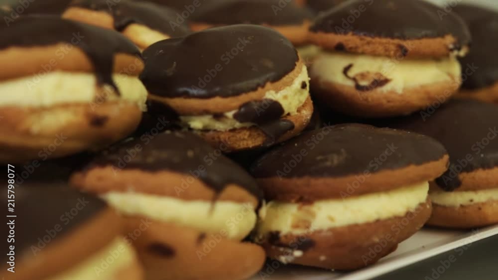 Cookies in the bakery. Freshly baked cookies. Cookies baked in the oven, close-up. Production of cakes at the confectionery factory Cookies in the bakery. Freshly baked cookies. Cookies baked in the oven, close-up. Production of cakes at the confectionery factory