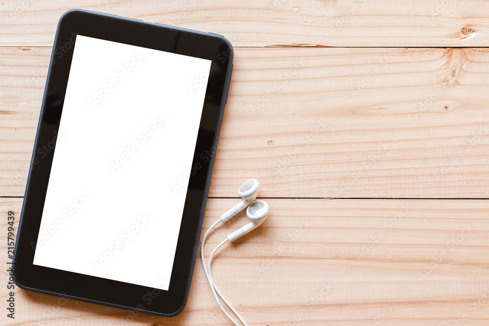 tablet computer with blank white screen on wooden background tablet computer with blank white screen on wooden background